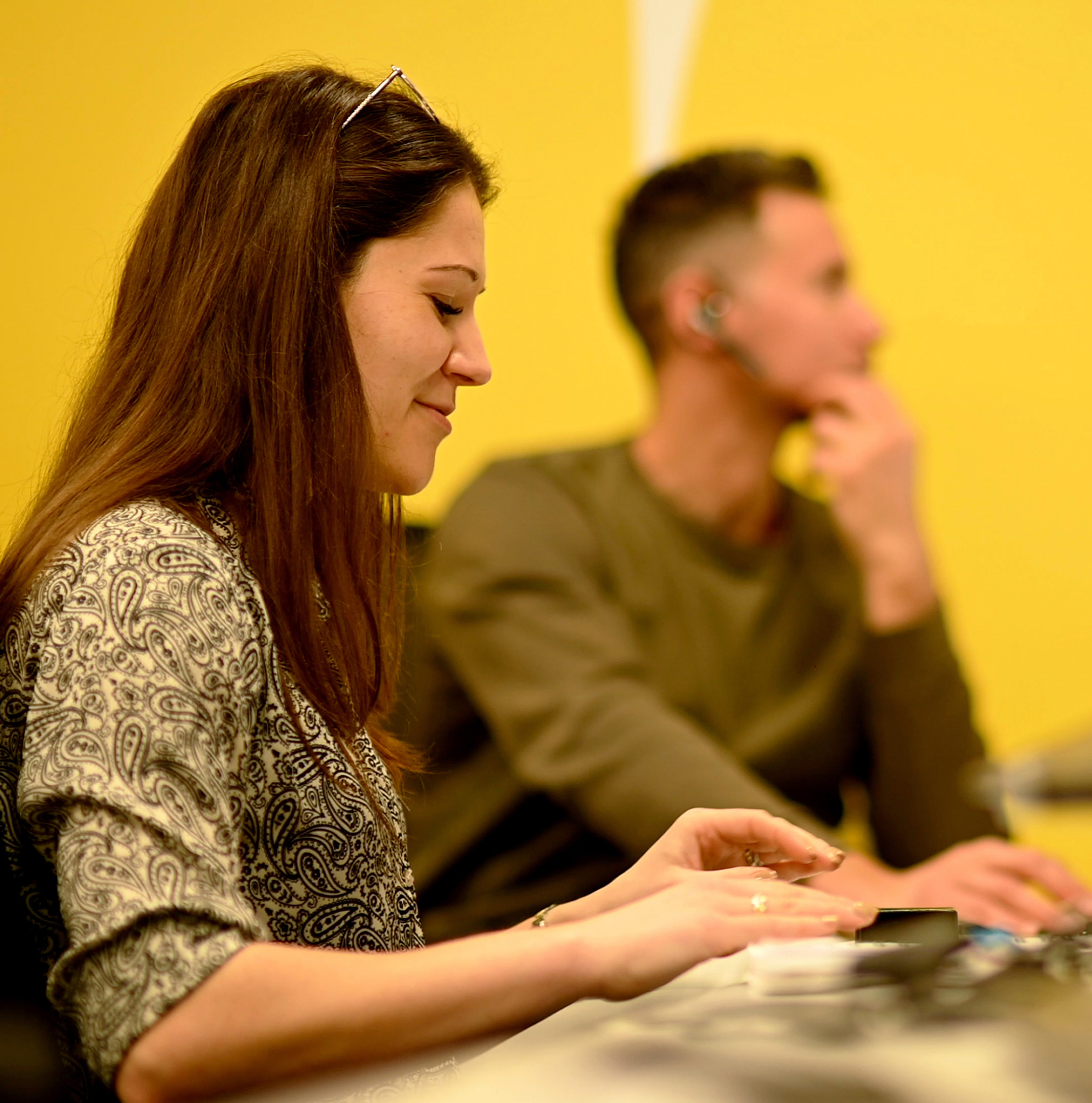 People in a meeting together making notes and working